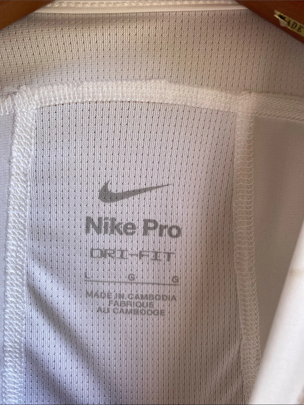 Nike Kids Protective Padded Athletic Shirt in white with Black Pads